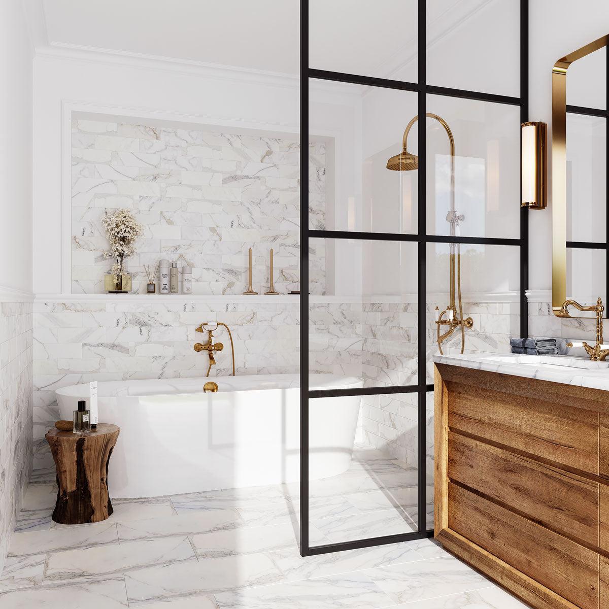 Open and airy bathroom with Calacatta Gold marble subway tiles