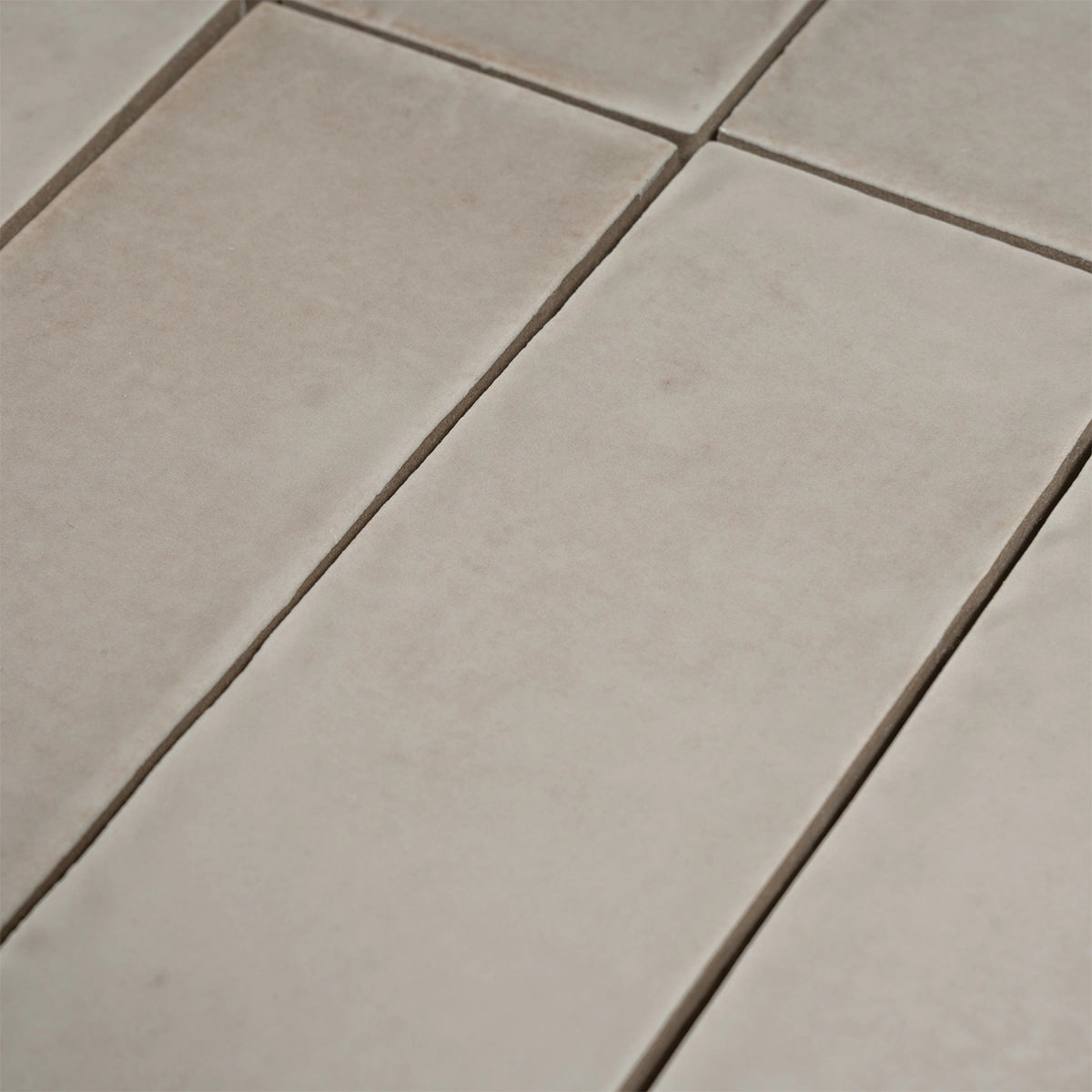 Calta Pearl Gray Gloss Porcelain Subway Tile 2x6 | Tile Club