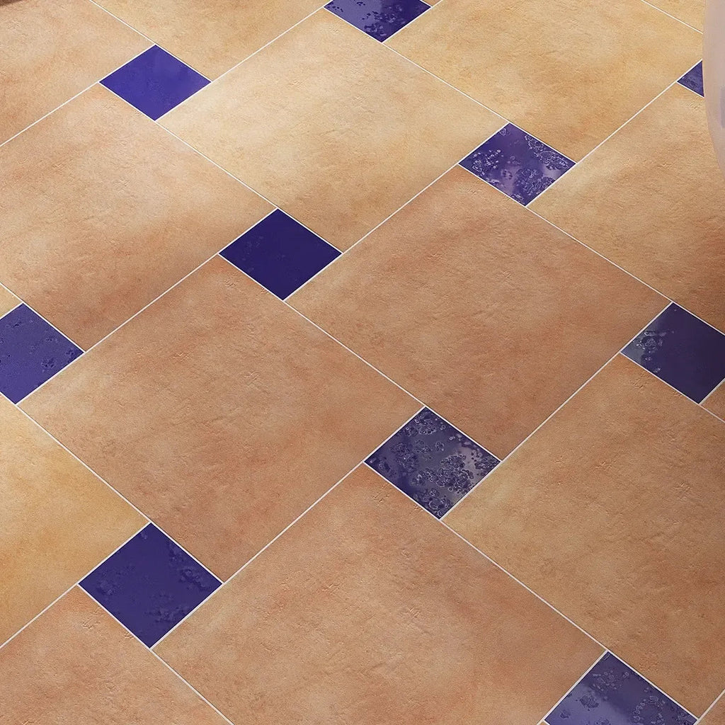 Square Terracotta Tile Floor with Decorative Blue Accents