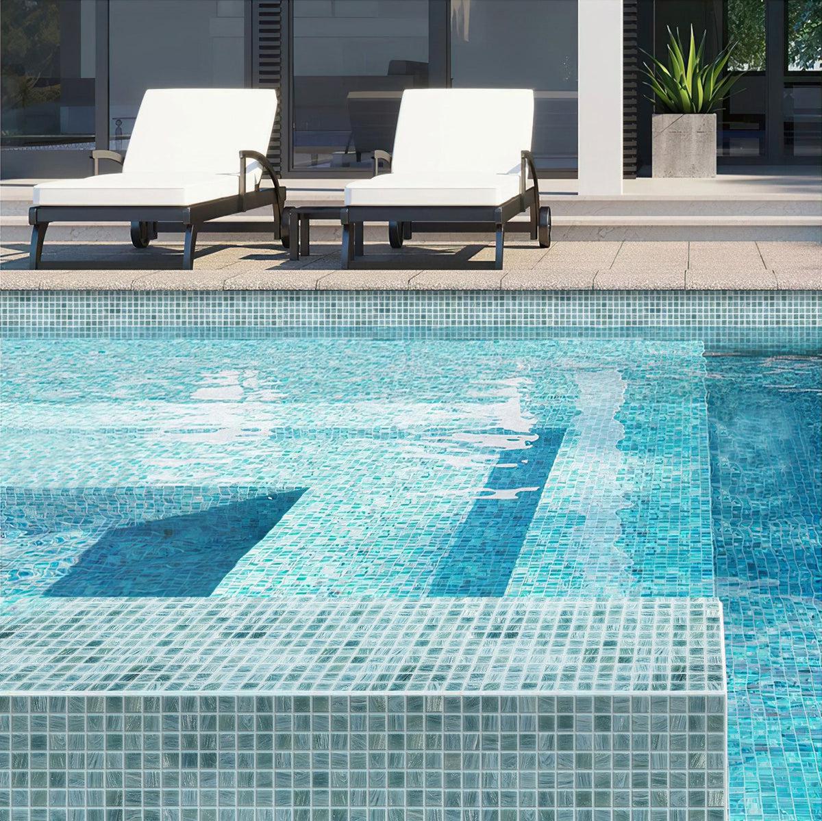 Outdoor pool with walls finished in Cloud Blue Gray Mixed Squares Glass Pool Tile