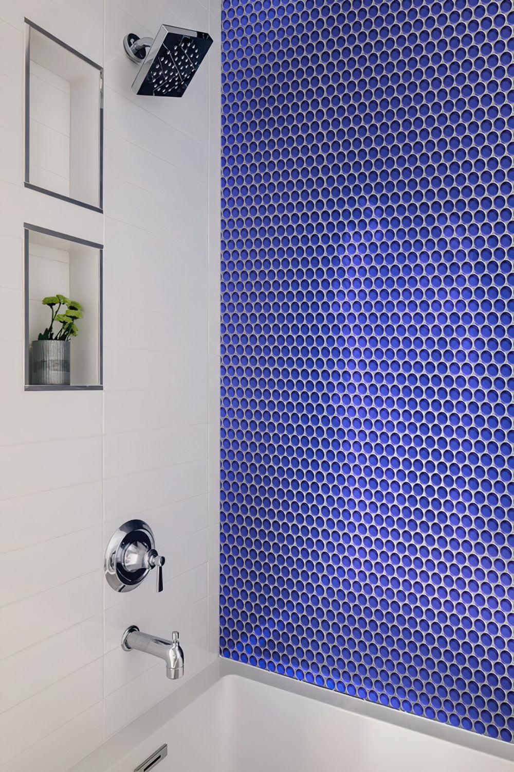 White shower with Cobalt Blue Penny Round Glass Tile backsplash
