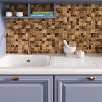 Copper metal mosaic tile backsplash with blue cabinets