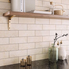 Warm beige marble subway tiles for a kitchen wall