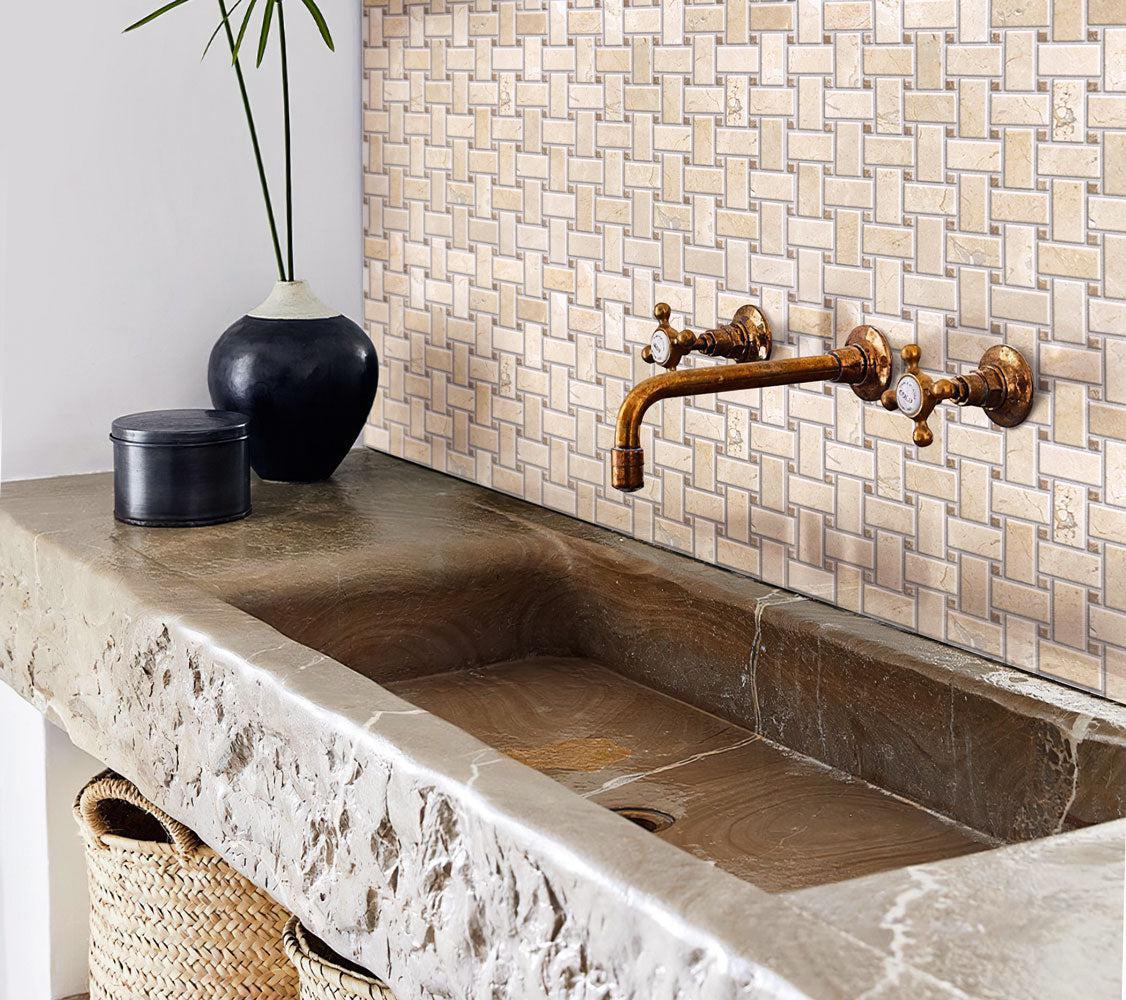 Bathroom with stone trough sink and Crema Marfil basket weave tile
