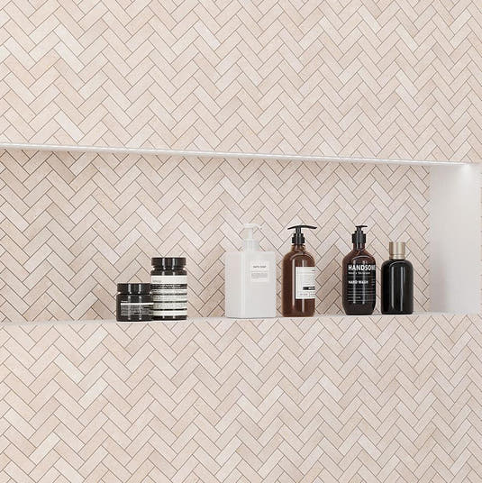 Shower Niche with Shampoos in the Crema Marfil Herringbone 1X3 Polished Marble Mosaic Wall