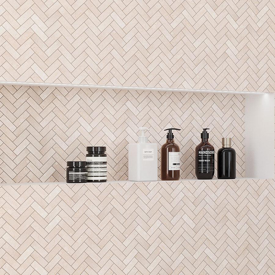 Shower Niche with Shampoos in the Crema Marfil Herringbone 1X3 Polished Marble Mosaic Wall