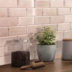 Glass Jar of Coffee on Background of Crema Marfil Subway With Dot Marble Mosaic Kitchen Wall