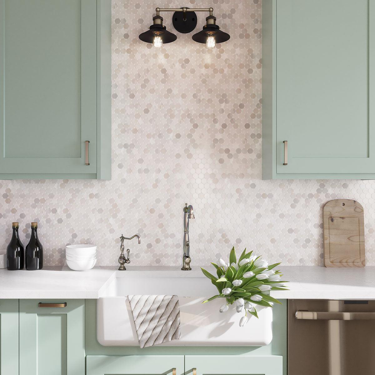Fresh green and white spring kitchen with a white marble penny round backsplash