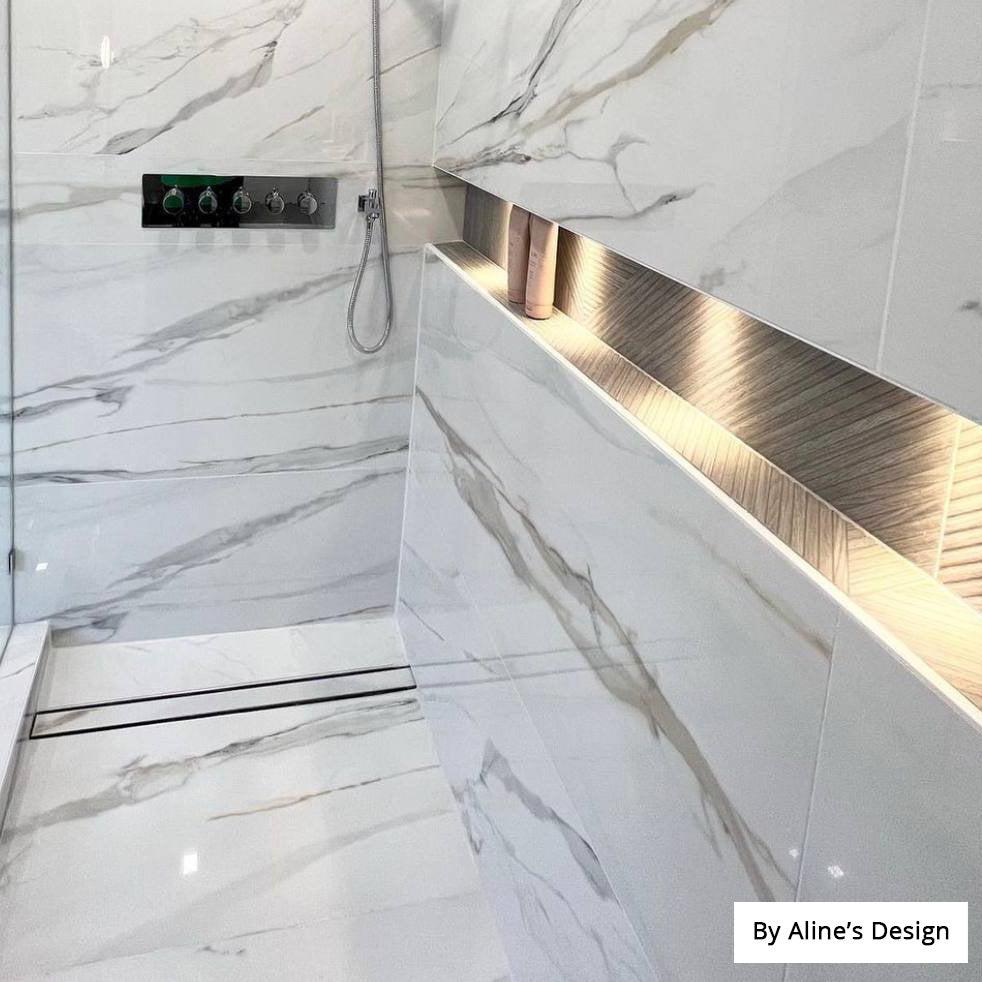 Standing shower with marble porcelain tile