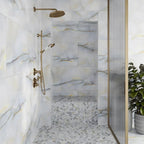 Blue stone look porcelain tile shower with matching mosaic floor tile