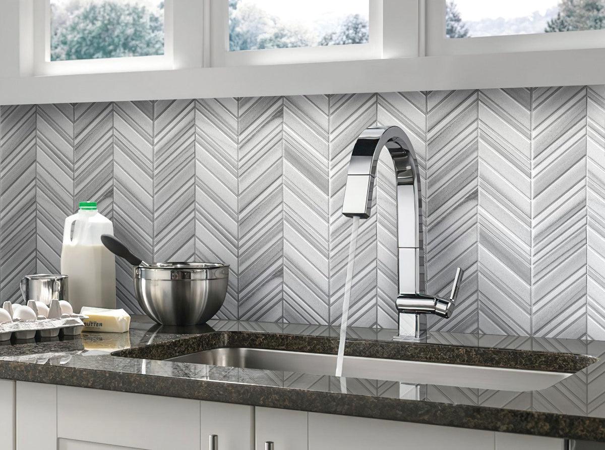 Light gray kitchen with polished chevron mosaic wall