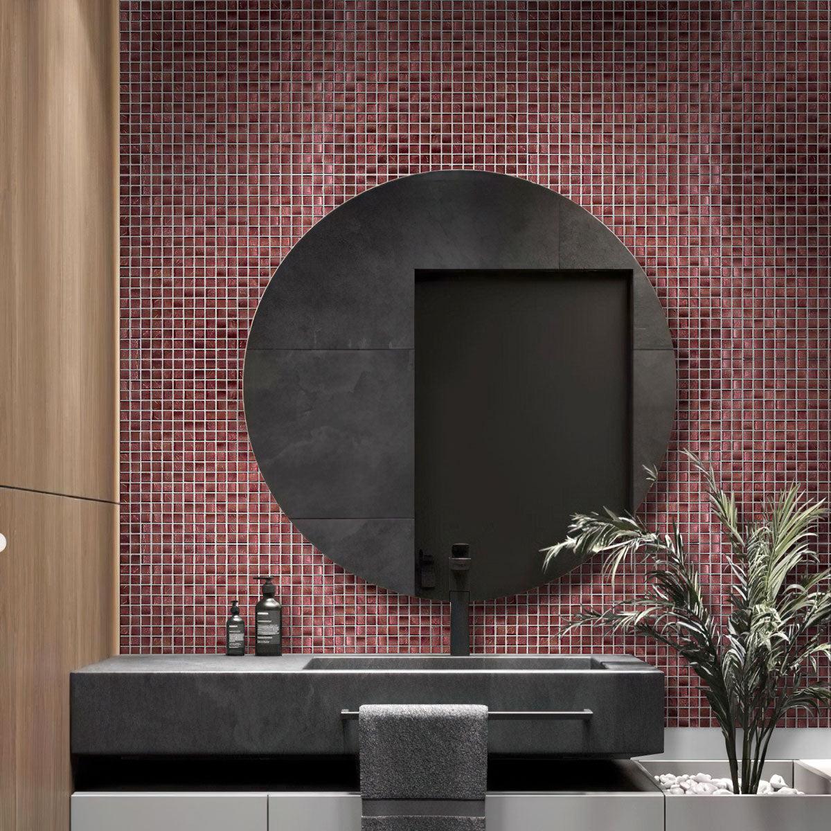 The bathroom is accented with Foiled Burgundy Squares Glass Tile