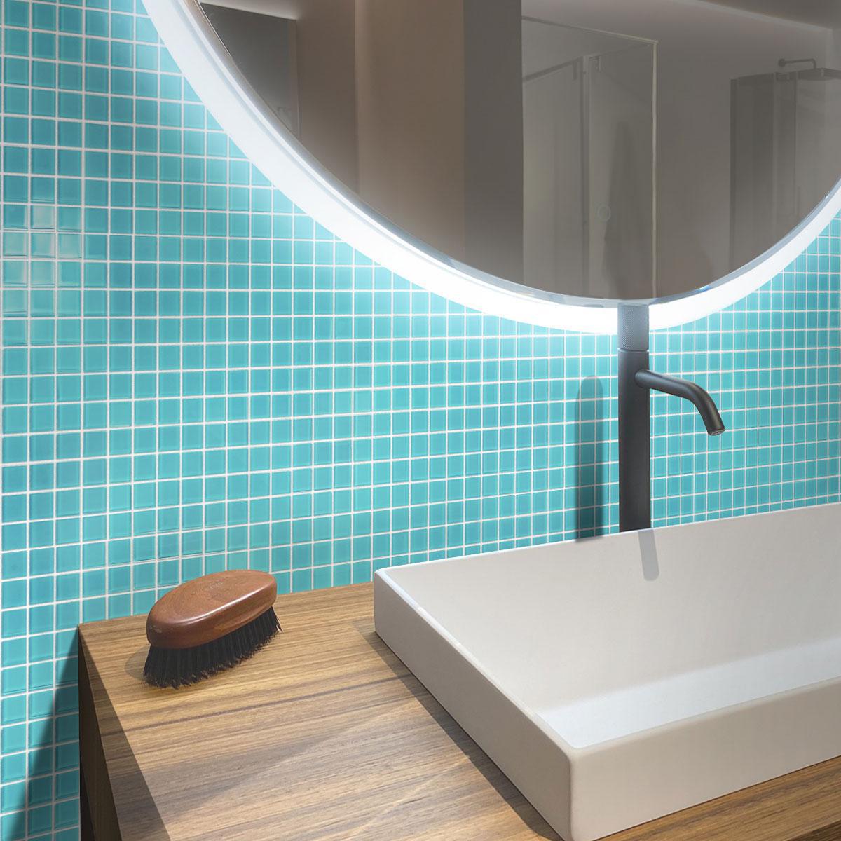 The Glacier Aqua Polished Glass Tile creates a stunning aquatic atmosphere