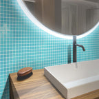 The Glacier Aqua Polished Glass Tile creates a stunning aquatic atmosphere
