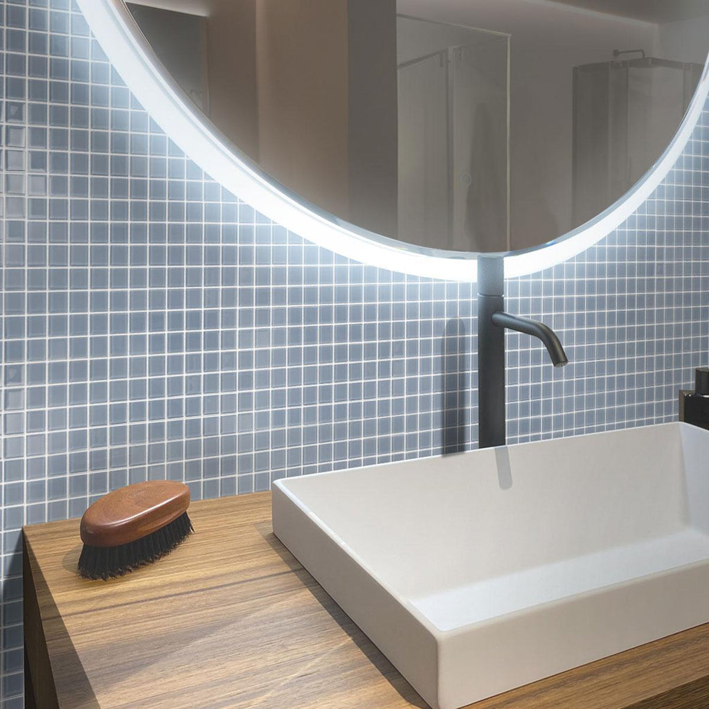 The Glacier Aura Gray Polished Glass Tile adds modern elegance to bathrooms