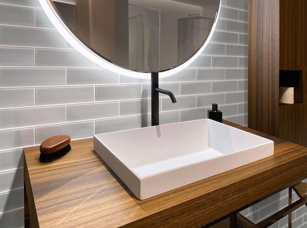 Gray frosted glass subway tile bathroom with wood vanity