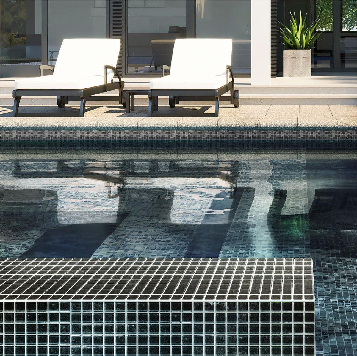Black polished glass tile swimming pool facing in sunlight