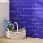 Wicker Basketon on Background of Glacier Cobalt Blue Glass Subway Tile