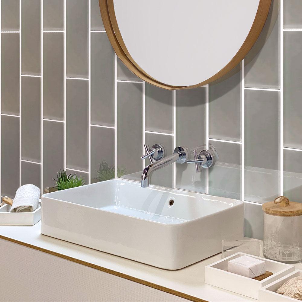 Glossy gray glass subway tile bathroom wall