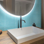 The Glacier Laguna Blue Frosted Glass Tile creates a relaxing spa-like ambiance