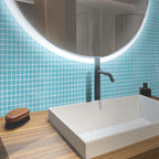 The Glacier Laguna Blue Polished Glass Tile exudes a calming coastal charm