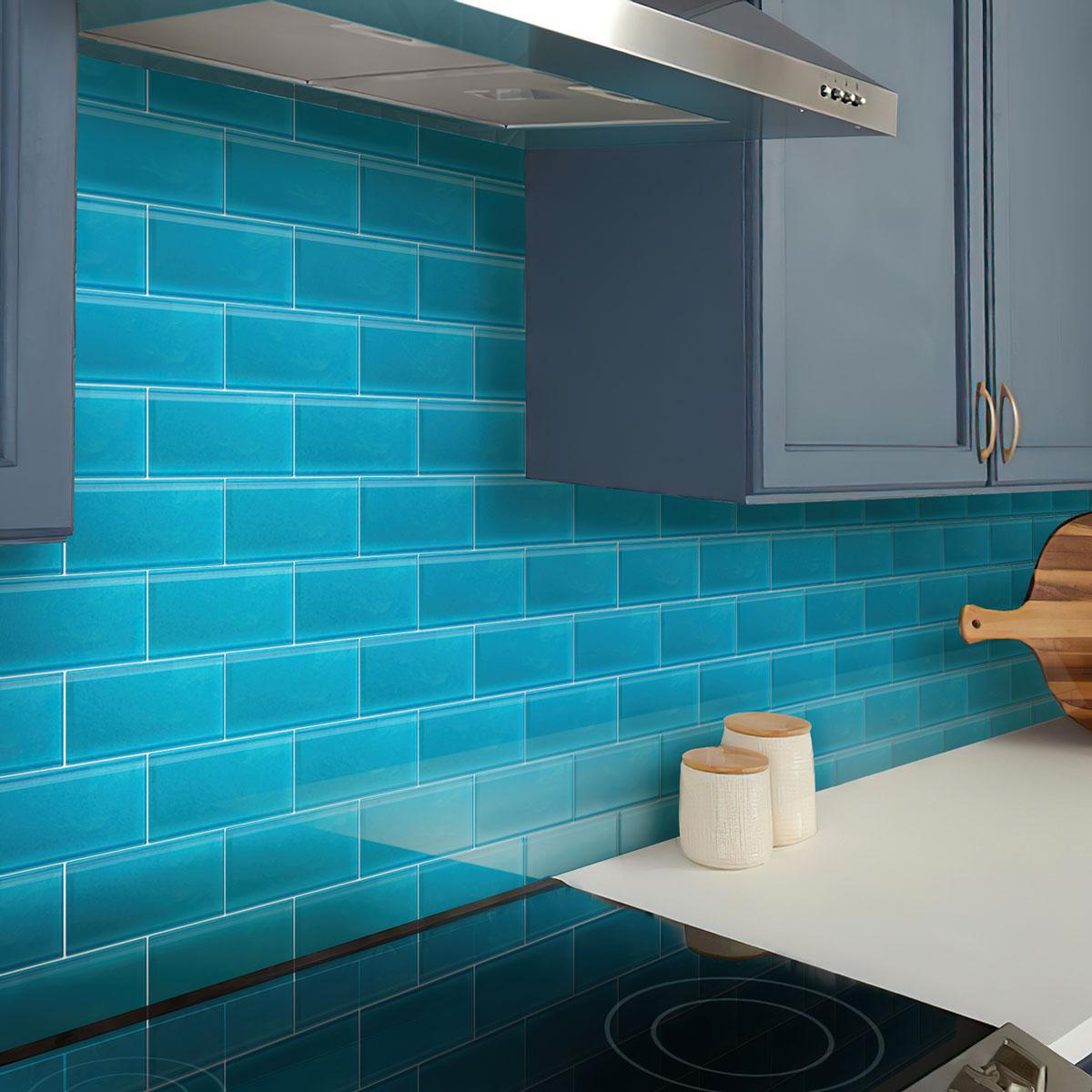 Glacier Laguna Blue 3X6 Frosted Glass Tile backsplash in kitchen with gray cabinets
