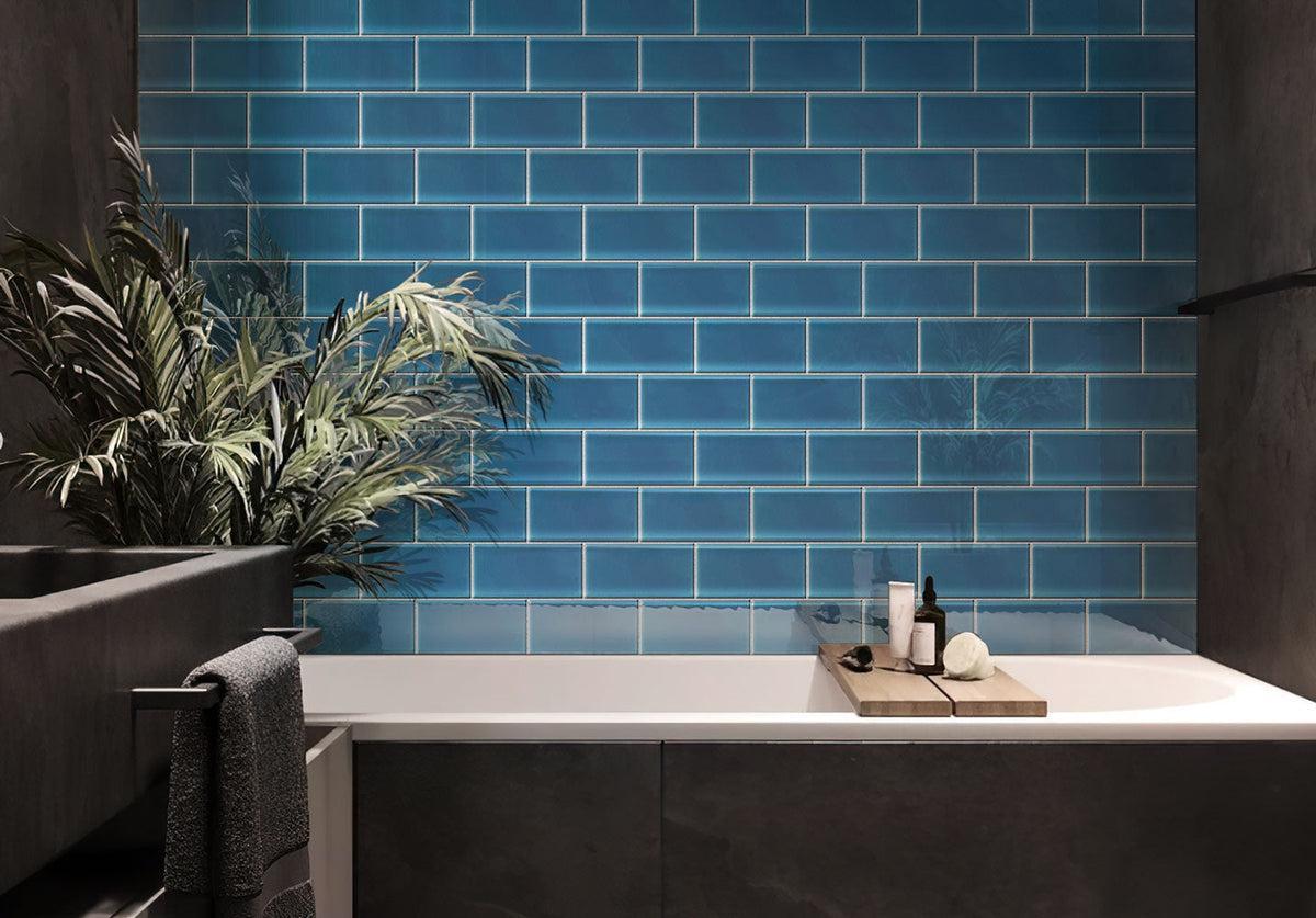 Dark grey bathroom with Glacier Ocean Blue 3" x 6" Polished Glass Tile backsplash