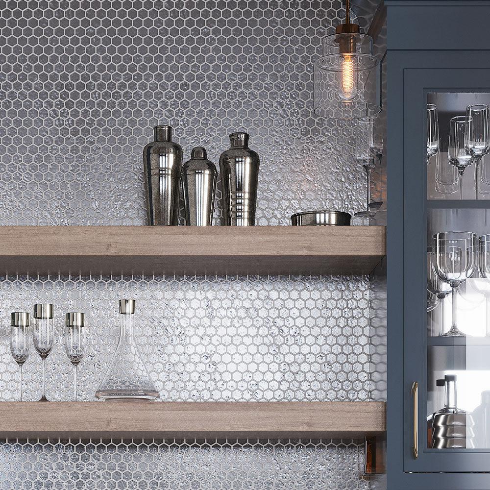 Silver Cocktail Shakers On A Shelf Against A Glossy Silver Hexagon Glass Mosaic Wall Background