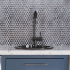 Black Kitchen Faucet and Sink on Glossy Silver Hexagon Glass Mosaic Tile Wall Background