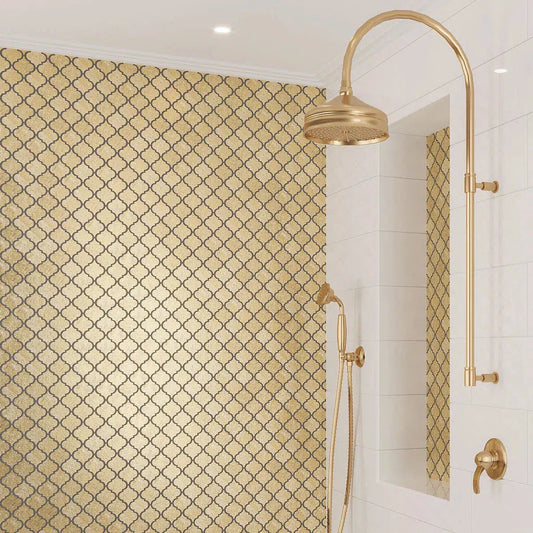 Gold resin arabesque tile for a gleaming shower wall and niche accent