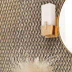 Modern lamp on the background of a Gold Diamond Glass Mosaic Tile wall