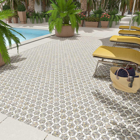 Hotel pool deck floor with speckled terrazzo mosaic tiles