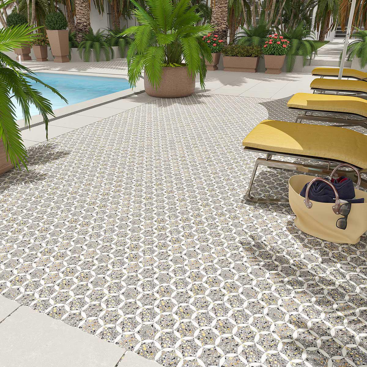 Hotel pool deck floor with speckled terrazzo mosaic tiles