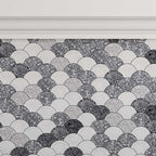 Gray and white fan tile with terrazzo speckles