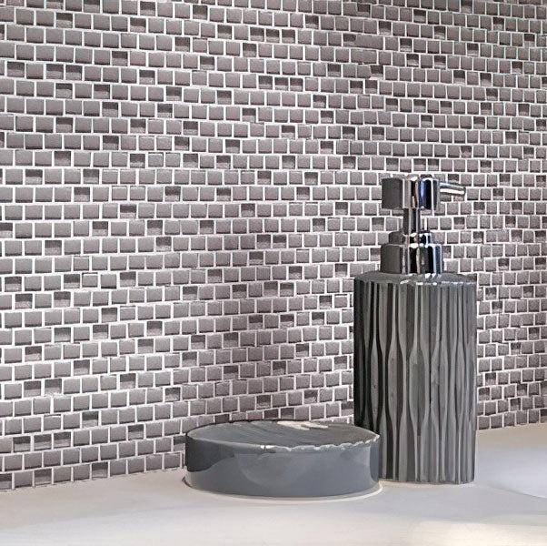 Soap Bottle on Background of Grey Recycled Glass Brick Mosaic
