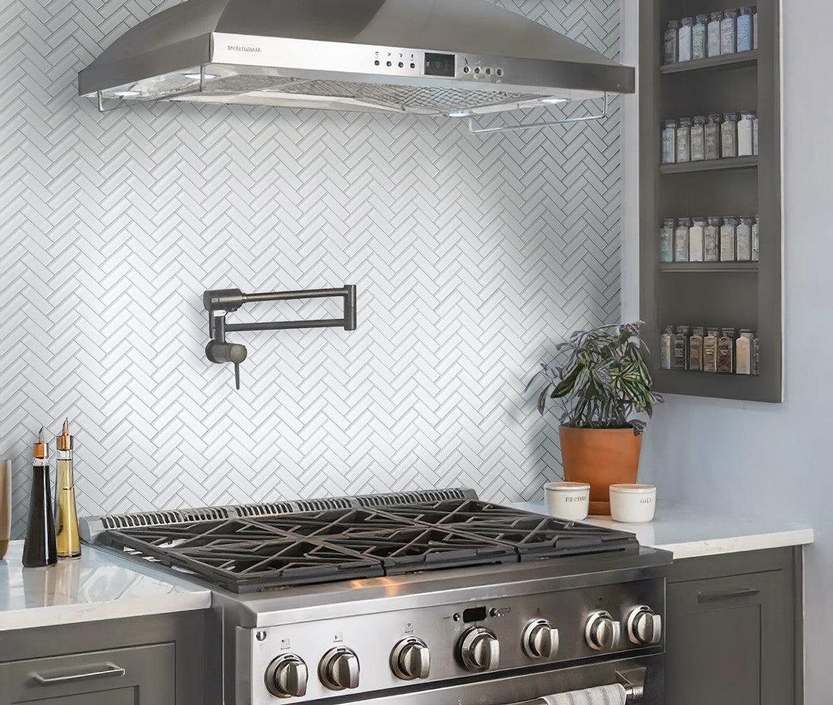 Chrome kitchen with Ice White Herringbone Glass Tile backsplash