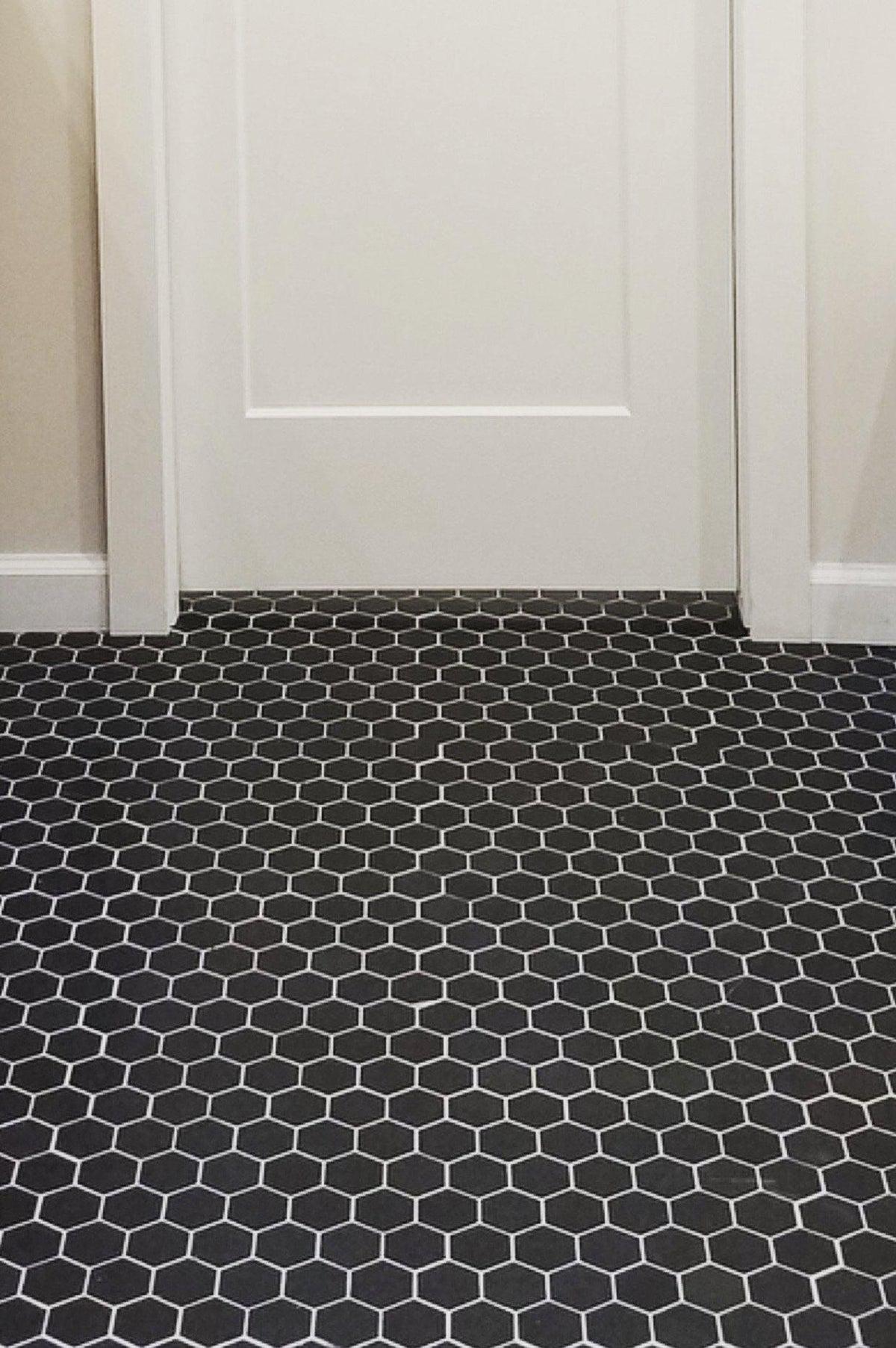Black marble hexagon tiled bathroom floor