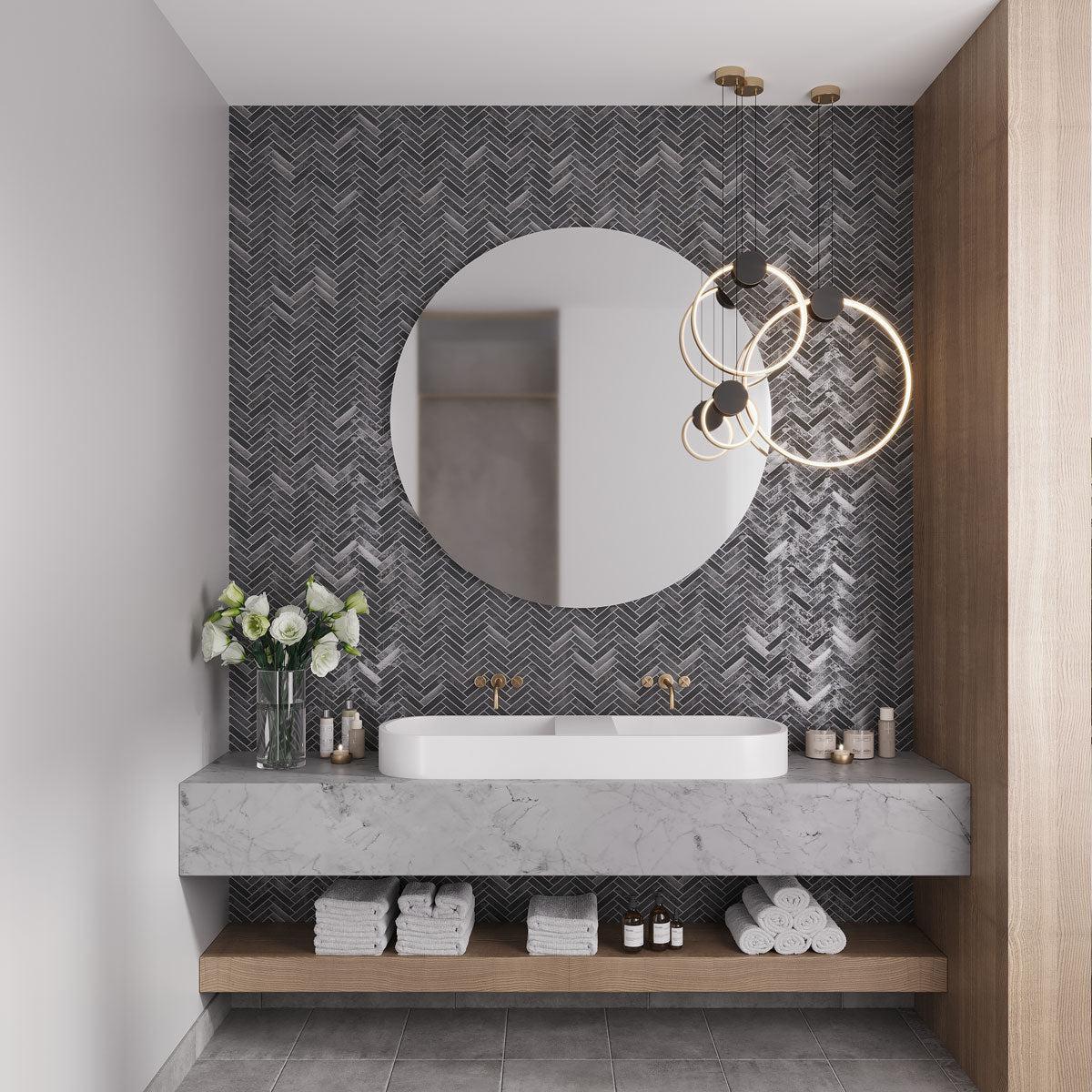 Modern steel and marble bathroom with herringbone backsplash tile