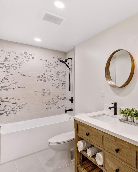 Wood look shower with Japanese cherry blossom patterns on porcelain tile