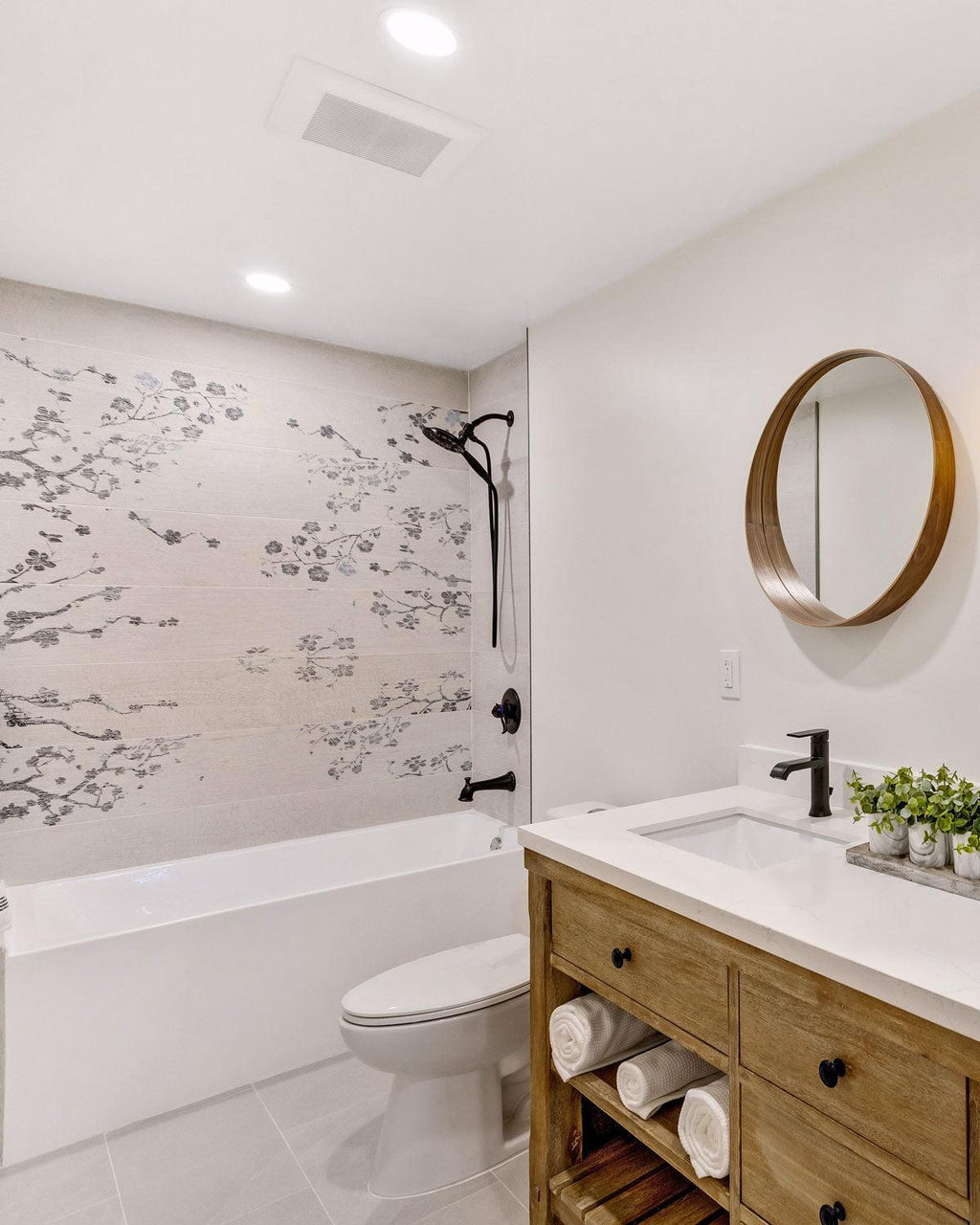 Wood look shower with Japanese cherry blossom patterns on porcelain tile