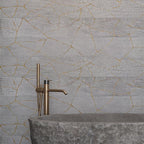 Bathroom made of wild stone on the background of the Kasai Fumo Kintsugi wall
