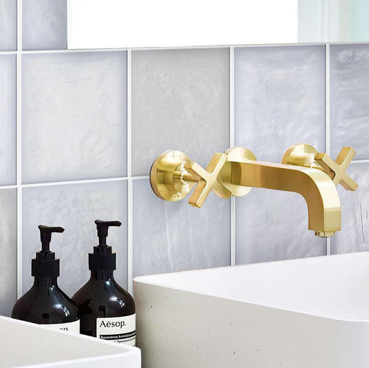 Golden Faucet and White Sink on the La Riviera Lavanda Blue Ceramic Wall Background
