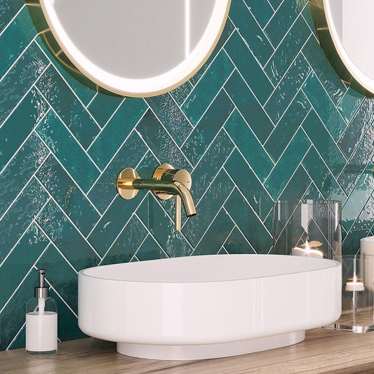 Green glazed ceramic subway tile in a herringbone pattern