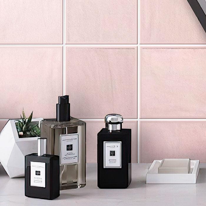 Toilet Table With Soap & Perfume on Background of La Riviera Rose Pink Ceramic Square Backsplash
