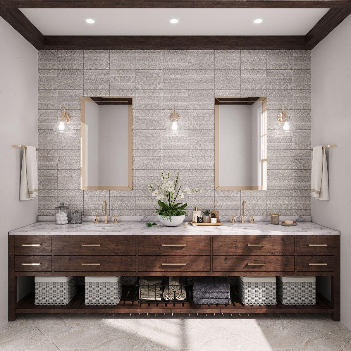 Elegant bathroom with Laguna Pearl glass subway tile backsplash and wood vanity with gold fixtures