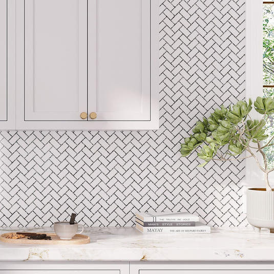 Light gray subway tile kitchen backsplash