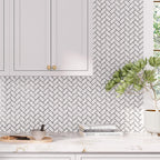 Light gray subway tile kitchen backsplash