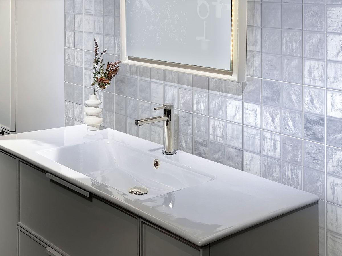 White & Brass Bathroom with Mallorca Blue Ceramic Tile Backsplash