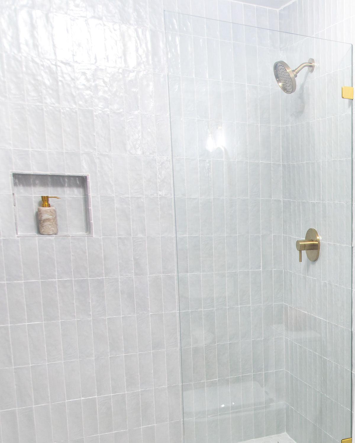 HGTV Battle of the Beach Bathroom renovation with Tile Club Mallorca Blue ceramic subway tile