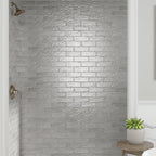 gray ceramic subway tile shower wall